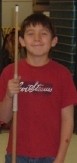 Spirit Lake boy holding pool cue